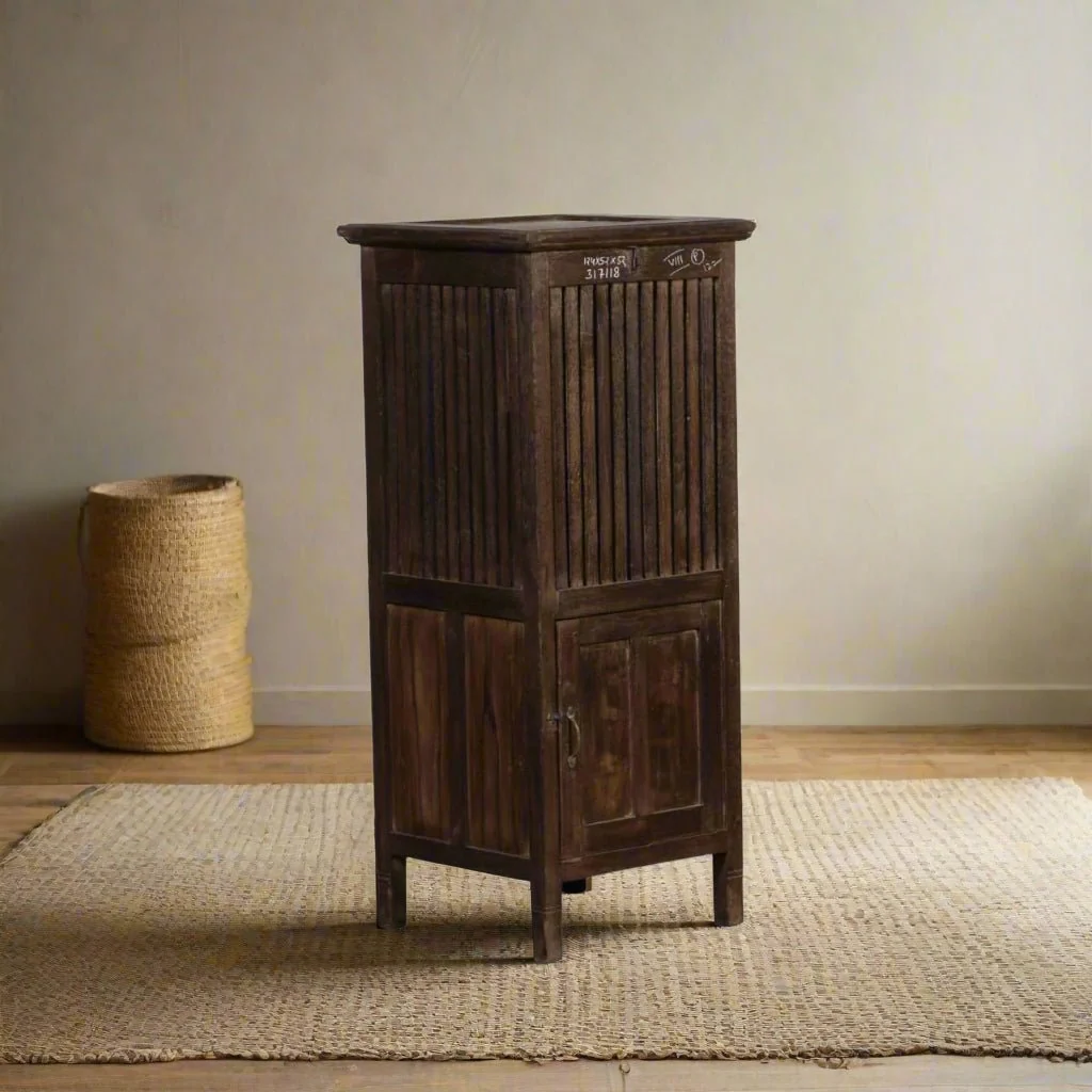 Vintage teak lounge chair beside a window