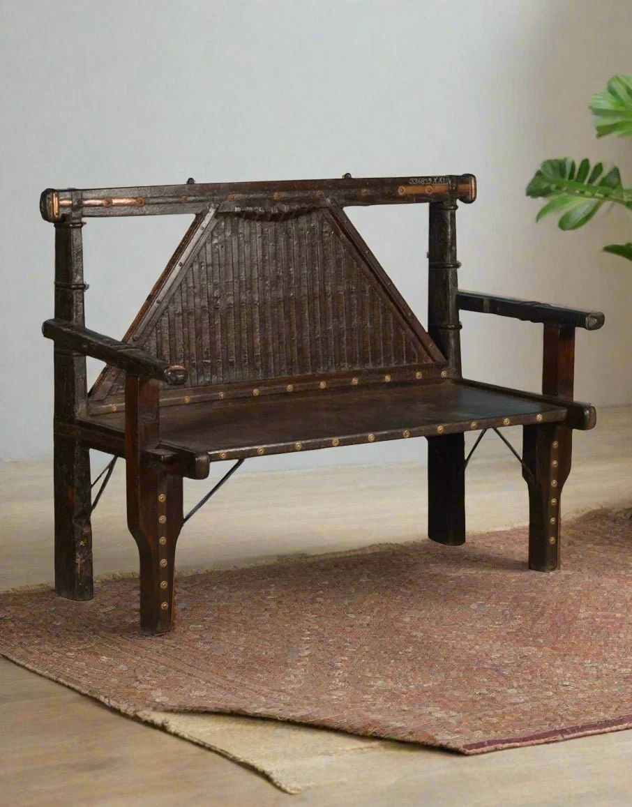 A restored carved hall bench